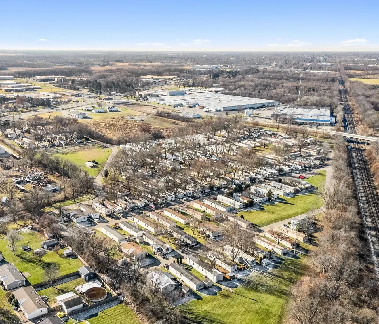 An aerial view of a residential area with lots of trees.