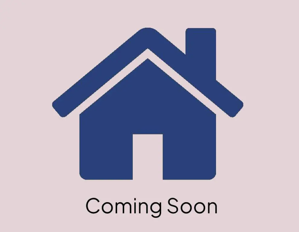 A blue house with the words " coming soon ".